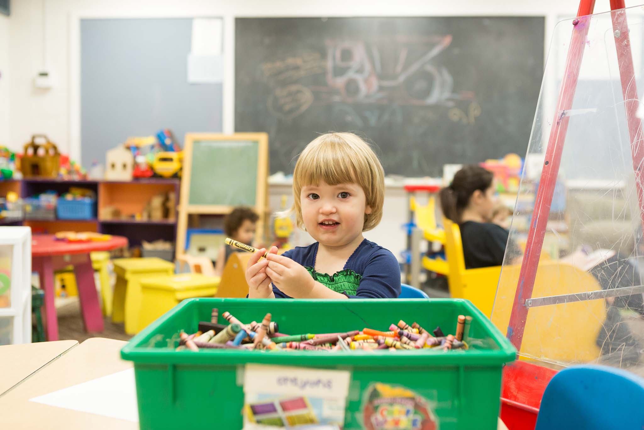 Toddler holding crayon