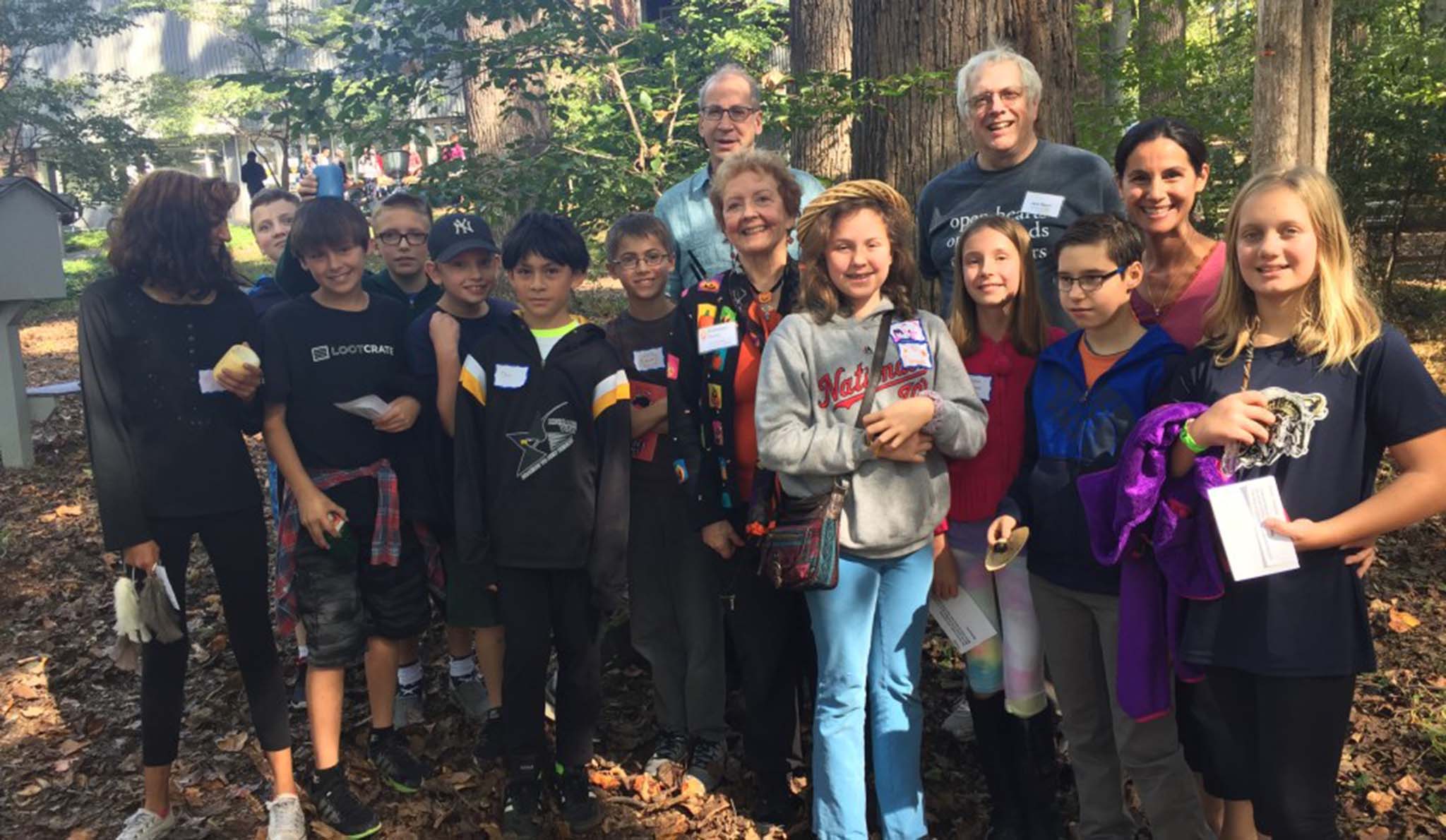 Group of children and adults standing outside